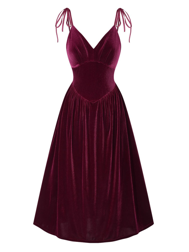 She slips into this Wine Red 1950s Spaghetti Strap Velvet Nightgown and suddenly it's a 1950s daydream
