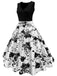 She wears 1950s Floral Swing Dress with vintage grace