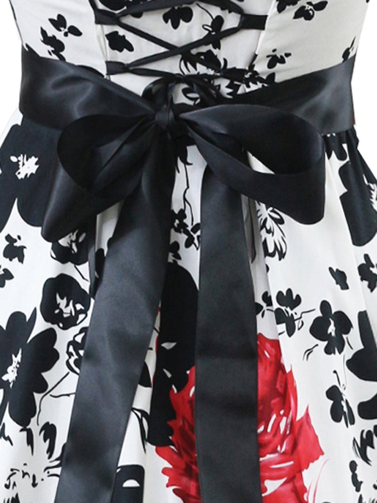 This White 1950s Floral Halter Swing Dress wraps her in 1950s elegance, one twirl at a time